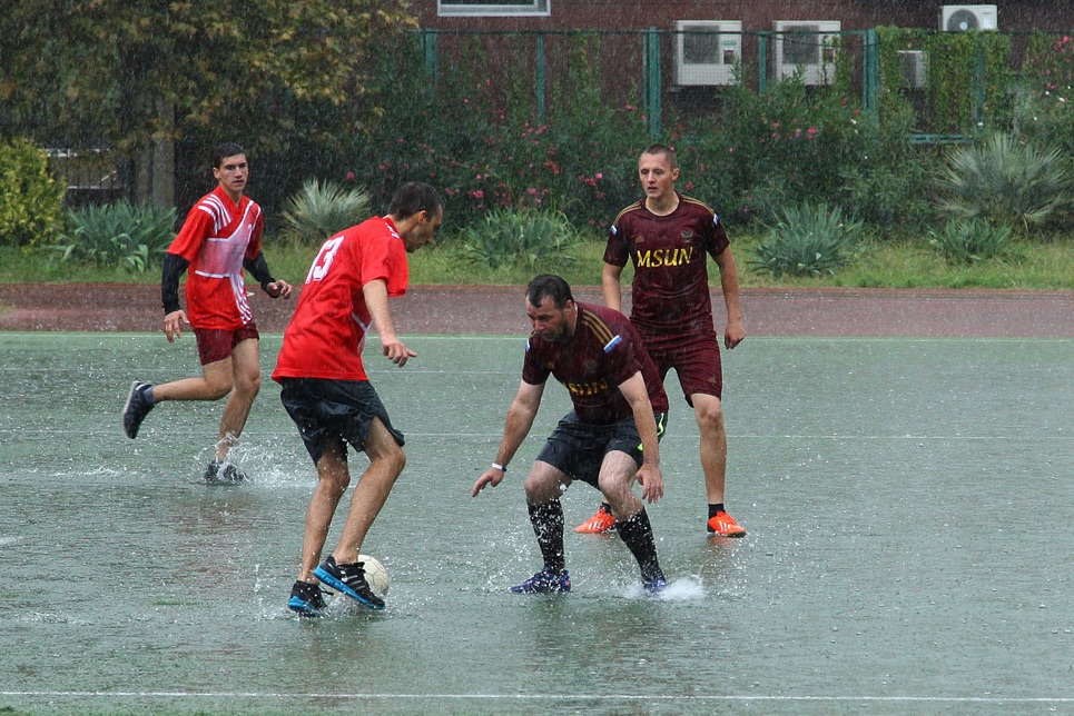 Playing football in the rain